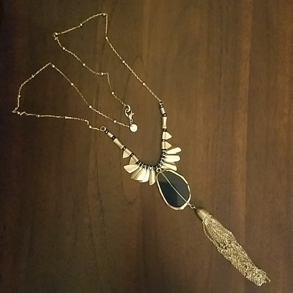 Gold pendant with blue stone